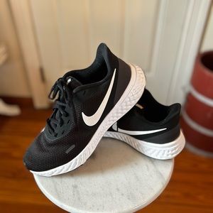 Gently used woman’s sneakers.